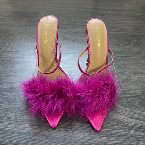 Fuchsia, open-toe strapless heels.